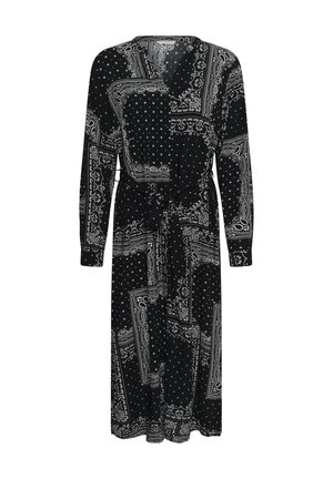Black long-sleeve midi dress with white paisley and polka dot patchwork prints, V-neck, and waist tie belt.