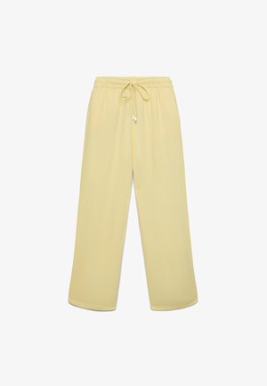 Pantalon ample jaune clair avec taille élastique et cordon de serrage, présenté à plat sur un fond blanc.