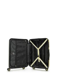 Valigia rigida beige aperta con interno nero, quattro ruote, scomparti con zip e cinghie incrociate beige all'interno per fissare gli oggetti.