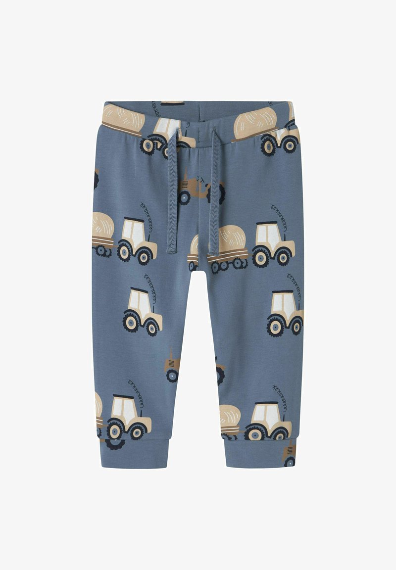 Baumwoll-Mischgewebe-Hosen in Blau mit gelbem und schwarzem Traktordruck, ausgestattet mit einem elastischen Bund und Bündchen, die für Komfort und Beweglichkeit konzipiert sind.