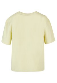 Short-sleeve t-shirt, cotton fabric, light yellow color, round neckline, relaxed fit, plain design, back view displayed.