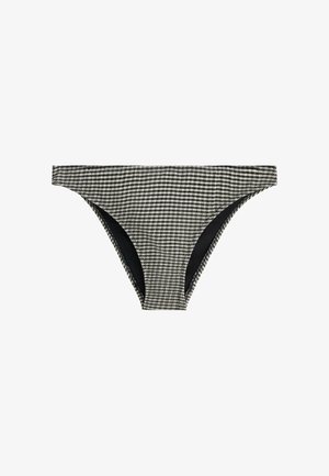 Schwarz-weiß karierte Bikinihose mit niedrigem Bund und moderater seitlicher Bedeckung auf weißem Hintergrund.