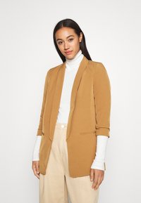 Brown, tailored blazer with a clean design, soft fabric, and open front. Features long sleeves, side pockets, and a smooth texture.
