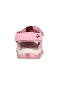 Rosa sandaler med kardborreband, mjukt material, vadderad vit sula och genomskinlig rosa sula. Har en logotyp på sidan.