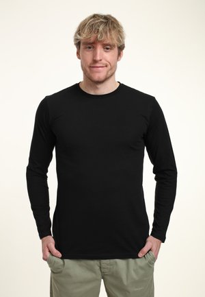 Schwarzes Langarm-T-Shirt mit rundem Ausschnitt, aus glattem Stoff gefertigt. Passt eng am Körper und hat ein einfaches, minimalistisches Design.
