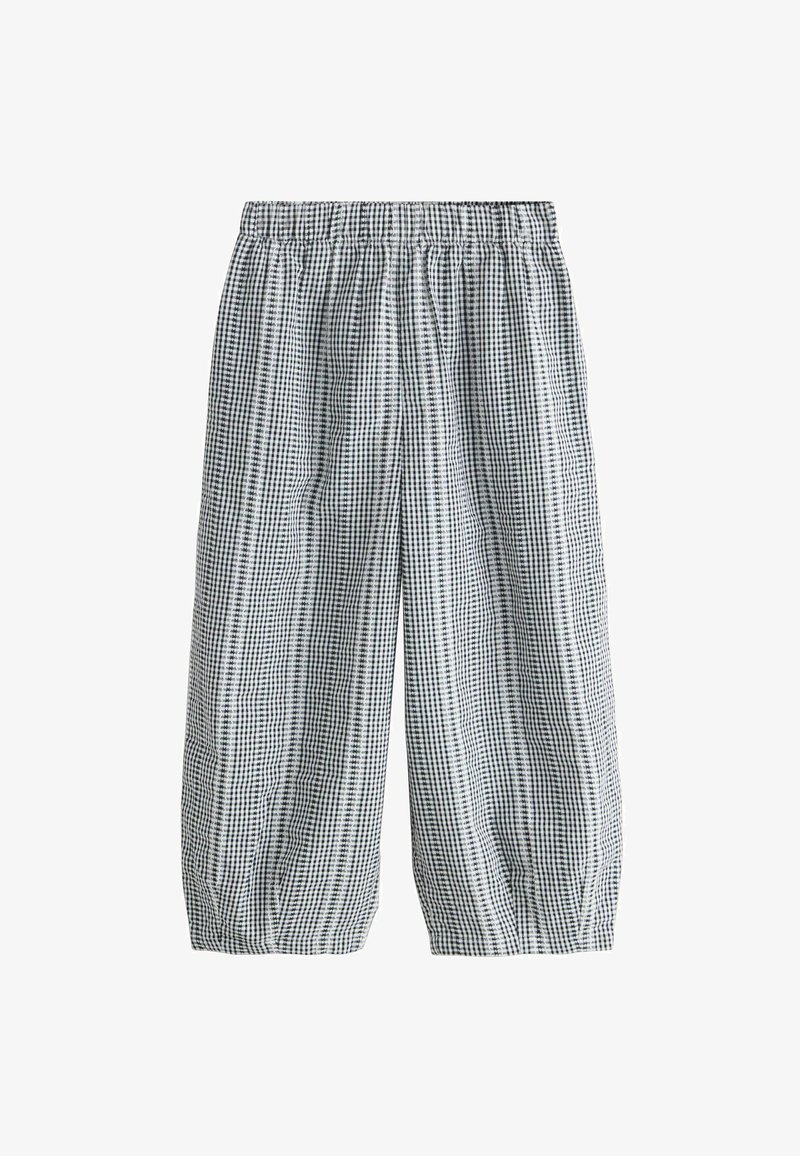 Pantalon court à carreaux vichy noir et blanc, taille élastique et coupe ample, avec poignets froncés aux chevilles.