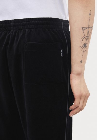 Noon Goons DIAL TRACKPANT - Tracksuit bottoms - black