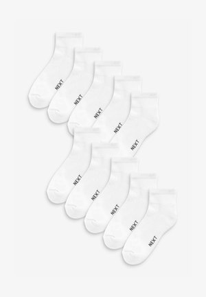 White cotton ankle socks, featuring a reinforced toe and a soft texture. Each sock has a small "NEXT" logo in black on the side. Pack of ten.