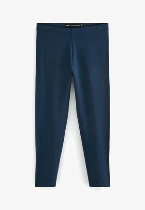 Leggings bleu marine à longueur ¾ fabriqués dans un matériau lisse et élastique. Ils sont dotés d'une large ceinture élastique. Sans motifs ni éléments visibles.