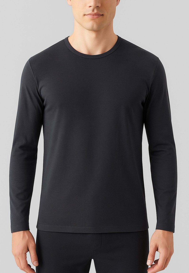 T-shirt a maniche lunghe di colore nero in un tessuto morbido con scollo rotondo. Presenta maniche aderenti e un orlo dritto, design minimalista senza fantasie.