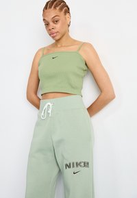 Nike Sportswear LOGO - Treniņtērpa apakšdaļas - jade horizon