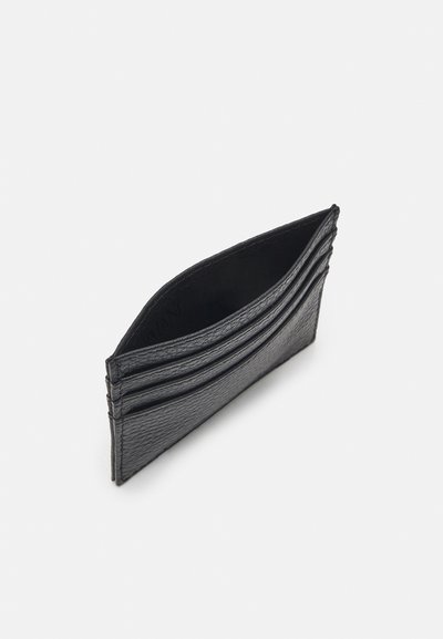 Black leather cardholder with textured surface, featuring multiple card slots and a slim design. Edges are stitched for durability.