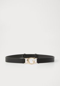 Curea din piele neagră cu o cataramă aurie în formă de litera "G" pe un fundal alb.
