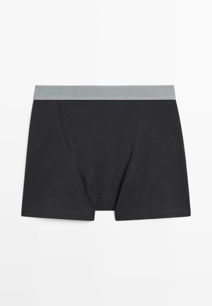 Boxershorts aus dunkelgrauem Baumwollstoff mit einem hellgrauen Bund. Zu den Merkmalen gehören eine enge Passform, flache Nähte und ein gesticktes Design an den Seiten.