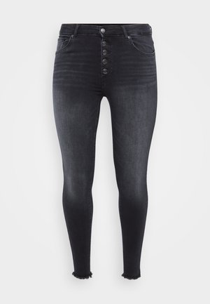 High-waisted black skinny jeans featuring a front button closure, faded texture, and frayed hem detail. Made from denim material.