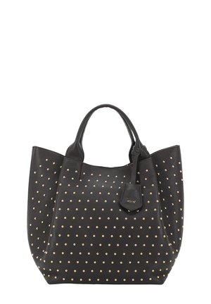 Black leather tote bag with gold studs, featuring rounded handles and a detachable tag. Smooth texture with a structured shape.