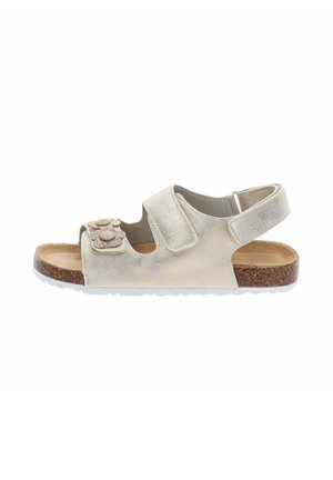 Sandalo beige per bambino con suola in sughero, due cinturini regolabili, di cui uno con applicazioni floreali, e cinturino posteriore per il supporto del tallone.