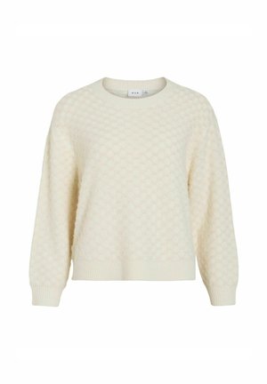 Kremfarget genser med et strukturert bikakemønster, rund halsringning og ribbestrikkede mansjetter og nederkant. Laget av mykt strikket stoff.