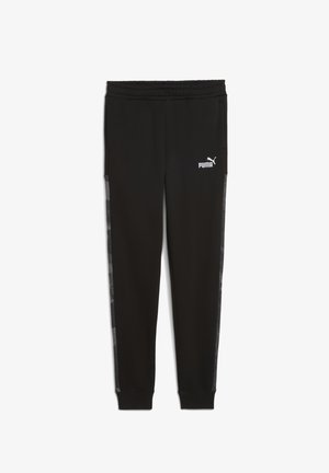 Fekete melegítőnadrág puha anyagból, elasztikus derékkal, oldalsó csíkkal, finom mintával, és egy fehér Puma logóval az elején.