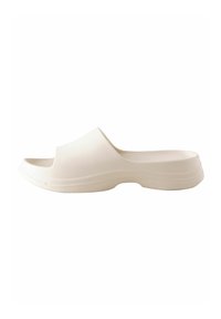 Hvid formstøbt slip-on sandal med åben tå, glat tekstur og en solid, kontureret sål. Ingen synlig hardware eller mønstre.
