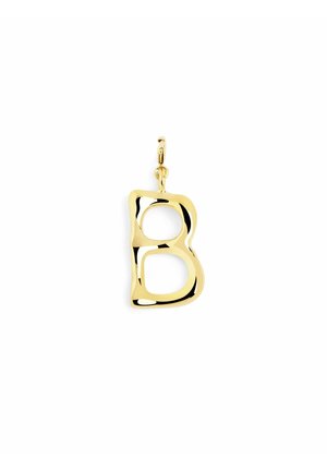 Zawieszka z metalu w kolorze złotym w kształcie litery B o gładkim, lekko nieregularnym obrysie i małej pętli do zawieszenia.