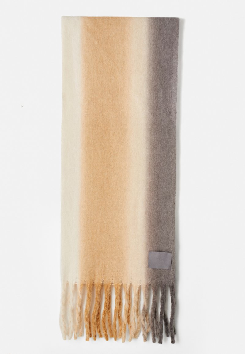Gradient scarf with beige, cream, and gray hues; soft fabric with fringe edges; includes a small gray tag sewn on one side.