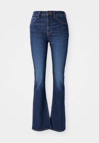 Blauwe flare jeans van denim, met een hoge taille, vijf pocketontwerp en contrasterende oranje stiksel langs de naden.