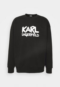 Sudadera negra de mezcla de algodón, con un logotipo gráfico blanco "KARL LAGERFELD" en negrita, estilo pincel, en el frente.