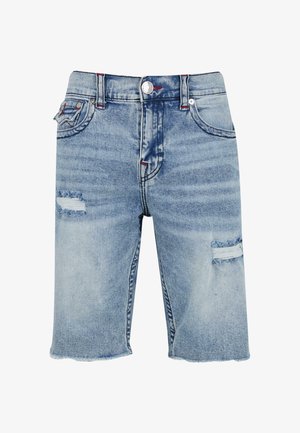 Světle modré džíny s volným střihem, které obsahují obroušené oblasti na přední straně, zapínání na knoflík a kontrastní švy.