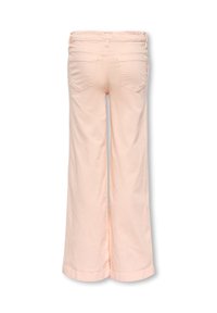 Light peach wide-leg trousers with a stretchy waistband, featuring two back pockets and a smooth, soft texture. The pants have sewn cuffs.
