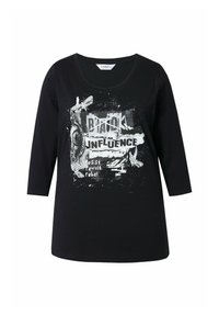 T-shirt noir à manches longues en coton avec un col rond, arborant une impression graphique blanche et du texte : "INFLUENCE NOIRE" et "résister, révolter, se rebeller."