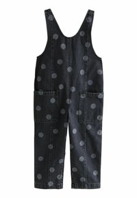 Pantalones de mezclilla en gris oscuro con grandes lunares en gris claro. Presentan tirantes anchos, dos bolsillos frontales y un diseño de pierna recta.