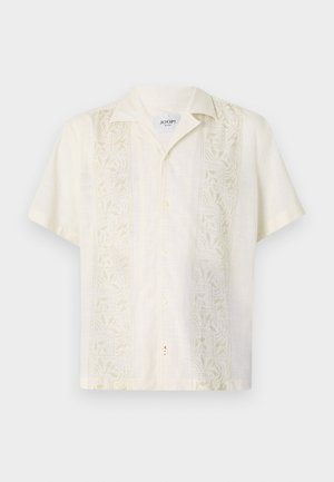 Rövid ujjú, világos bézs ing, galléros nyakkal, finom levél mintákkal hímzettek mindkét oldalon és elöl gombos záródással.