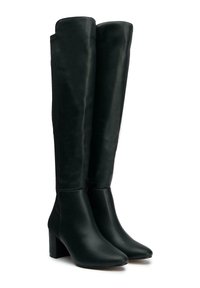Pair of black knee-high boots with block heels, pointed toes, and smooth leather texture on a white background.