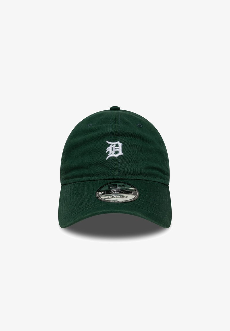Grønn justerbar caps laget av bomull med en buet skjerm. Har hvit brodert logo på fronten og snapback-lukking.