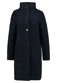 Cappotto in lana blu navy, textured, con colletto alto, quattro bottoni e due tasche frontali. Taglio dritto con maniche lunghe.