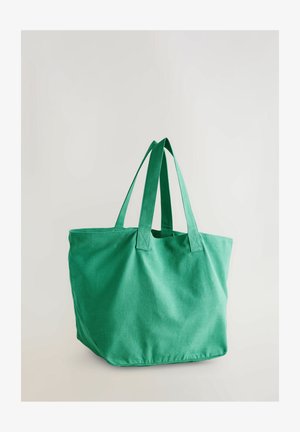 Sac en toile vert avec deux poignées robustes, design spacieux et texture lisse. Aucun matériel ni motif visible.