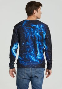 Long-sleeve sweatshirt featuring a galaxy print in blue and black, with a round neckline and ribbed cuffs. Textured fabric with a smooth finish.