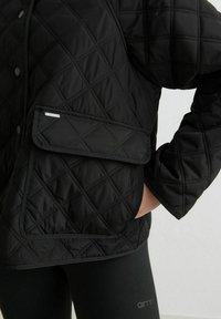 aim’n® QUILTED FEMME - Light jacket - black