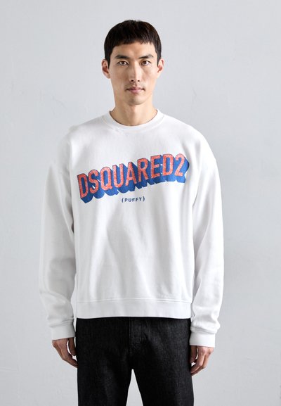 Sweat-shirt blanc avec un grand logo "DSQUARED2 (PUFFY)" multicolore en bleu et rouge. Fabriqué en tissu doux avec des poignets et un ourlet côtelés.