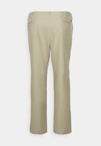 Beiga byxor med rak bendesign, med en mjuk textur, bältesöglor och två bakfickor.