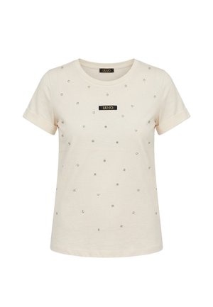 T-shirt beige à manches courtes avec revers roulés, décoré de petits clous brillants et d'un patch logo rectangulaire noir "LIU·JO" sur la poitrine.