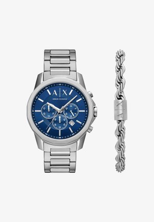 Montre en acier inoxydable avec un boîtier octogonal, un cadran bleu, des accents argentés, trois sous-cadrans et un affichage de la date. Comprend un bracelet en argent torsadé.