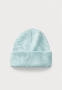 Light blue knitted beanie made of soft fabric, featuring vertical ribbed texture and a turned-up cuff at the base.