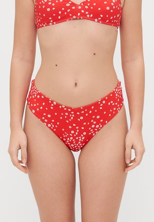 Red bikini set featuring a floral pattern in white. The top has a v-neck design, while the high-waisted bottom offers full coverage.