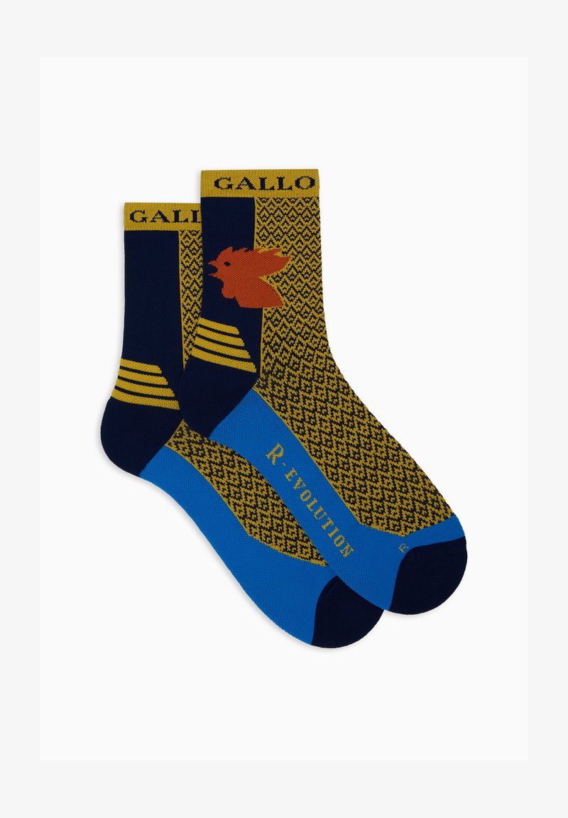 Bunte Socken mit einem blauen Grund und einem goldenen geometrischen Muster. Eine Socke hat ein oranges Design und gelbe Streifen nahe dem Bündchen.