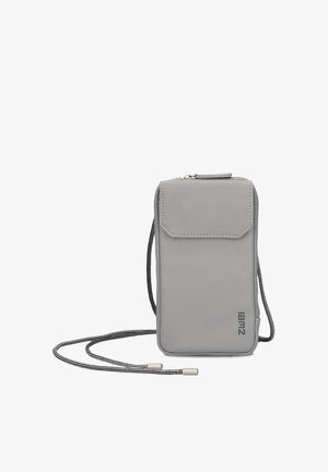 Small grey crossbody phone bag with front flap pocket, zipper top, and black-and-white adjustable cord strap.