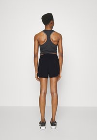 Under Armour VANISH - Sports shorts - black