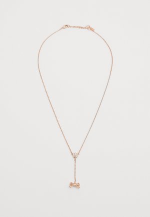 Náhrdelník z ružového zlata s jemným retiazkovým sponom a príveskom v tvare mašle. Obsahuje malý kvetinový akcent s predĺženým dizajnom. Hladký povrch.