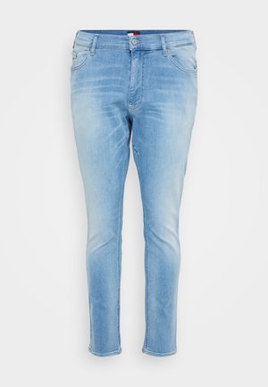 Jeans en denim bleu clair avec une coupe slim, design à cinq poches et détails décolorés ; comportent une fermeture à bouton et des passants de ceinture.